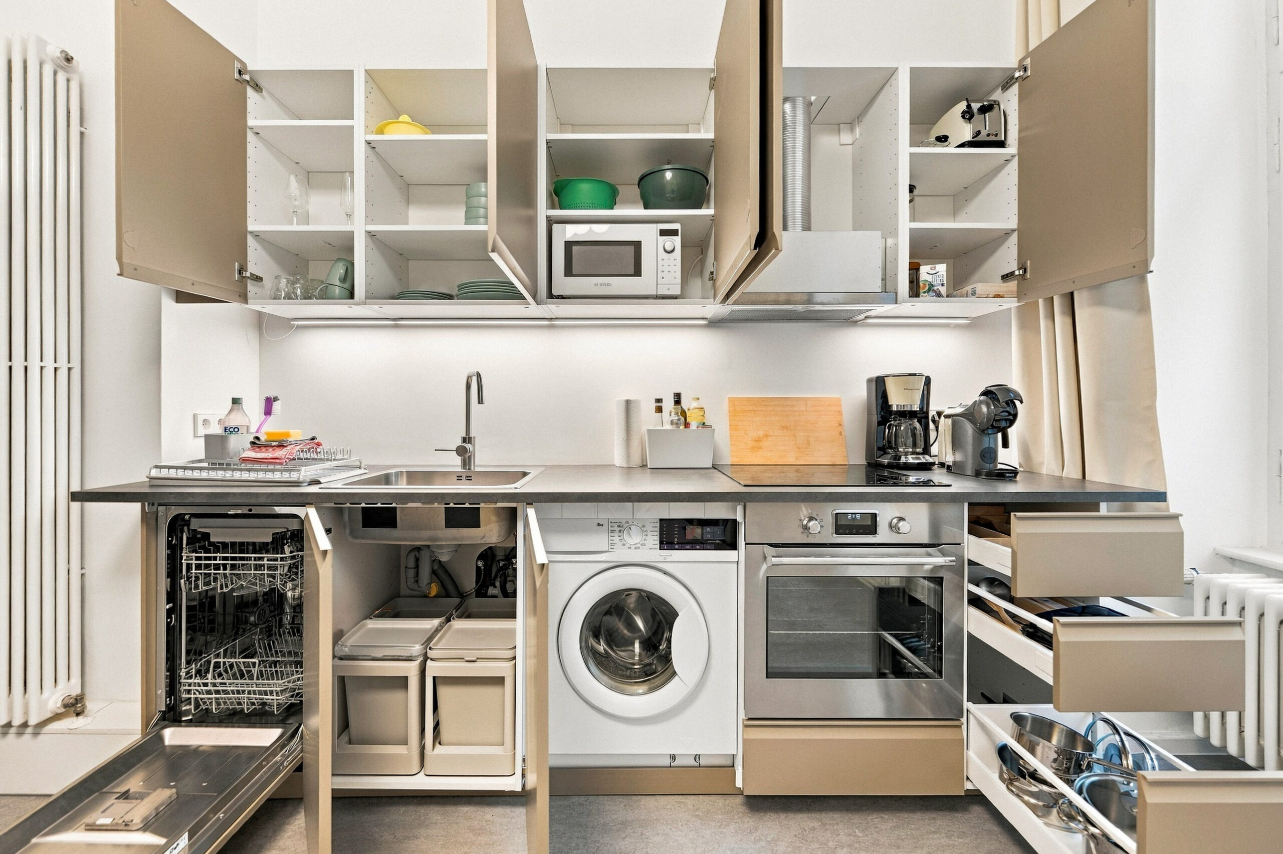 Modern kitchen with open cabinets and appliances