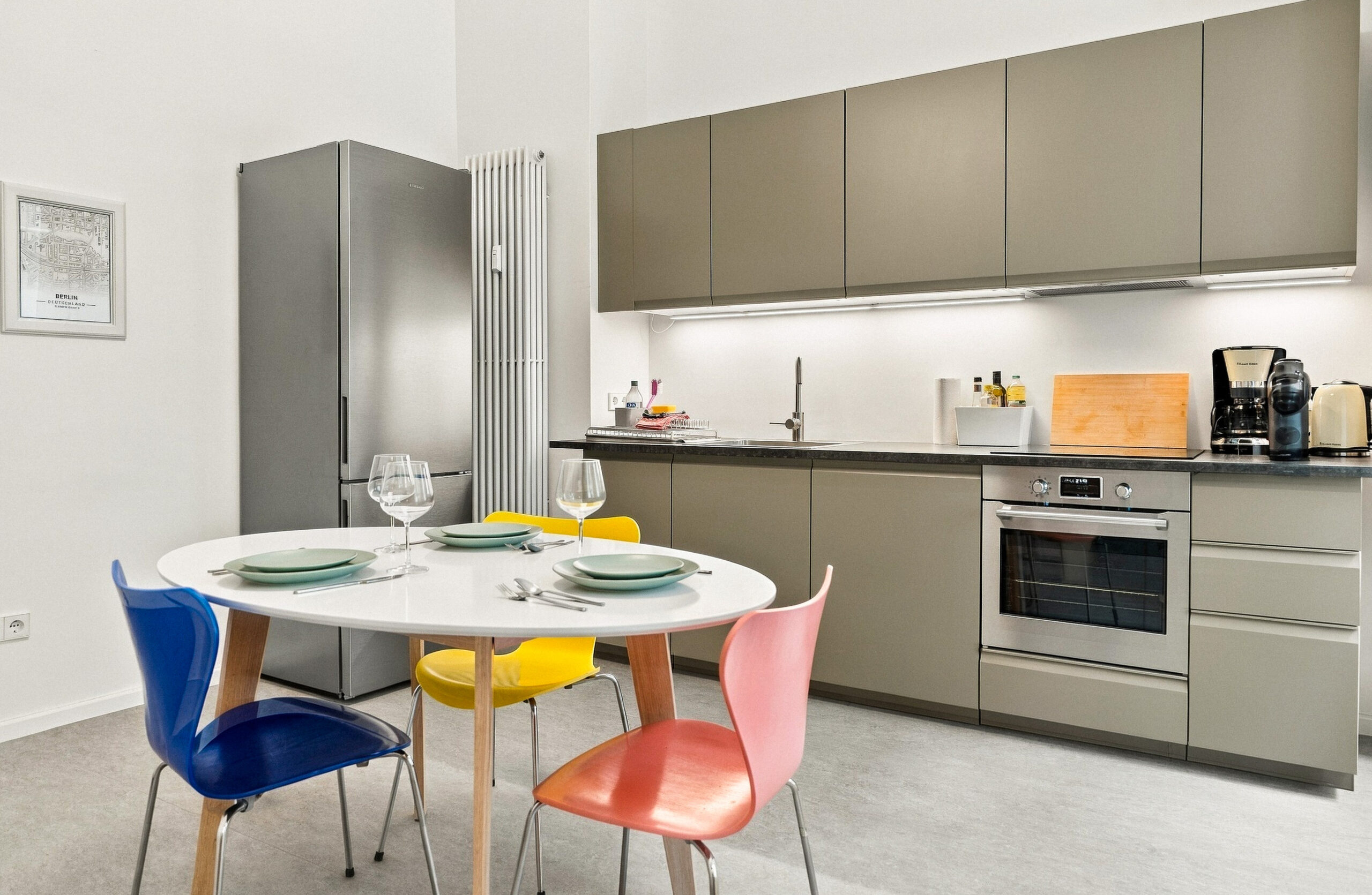 Modern kitchen with colorful chairs and table