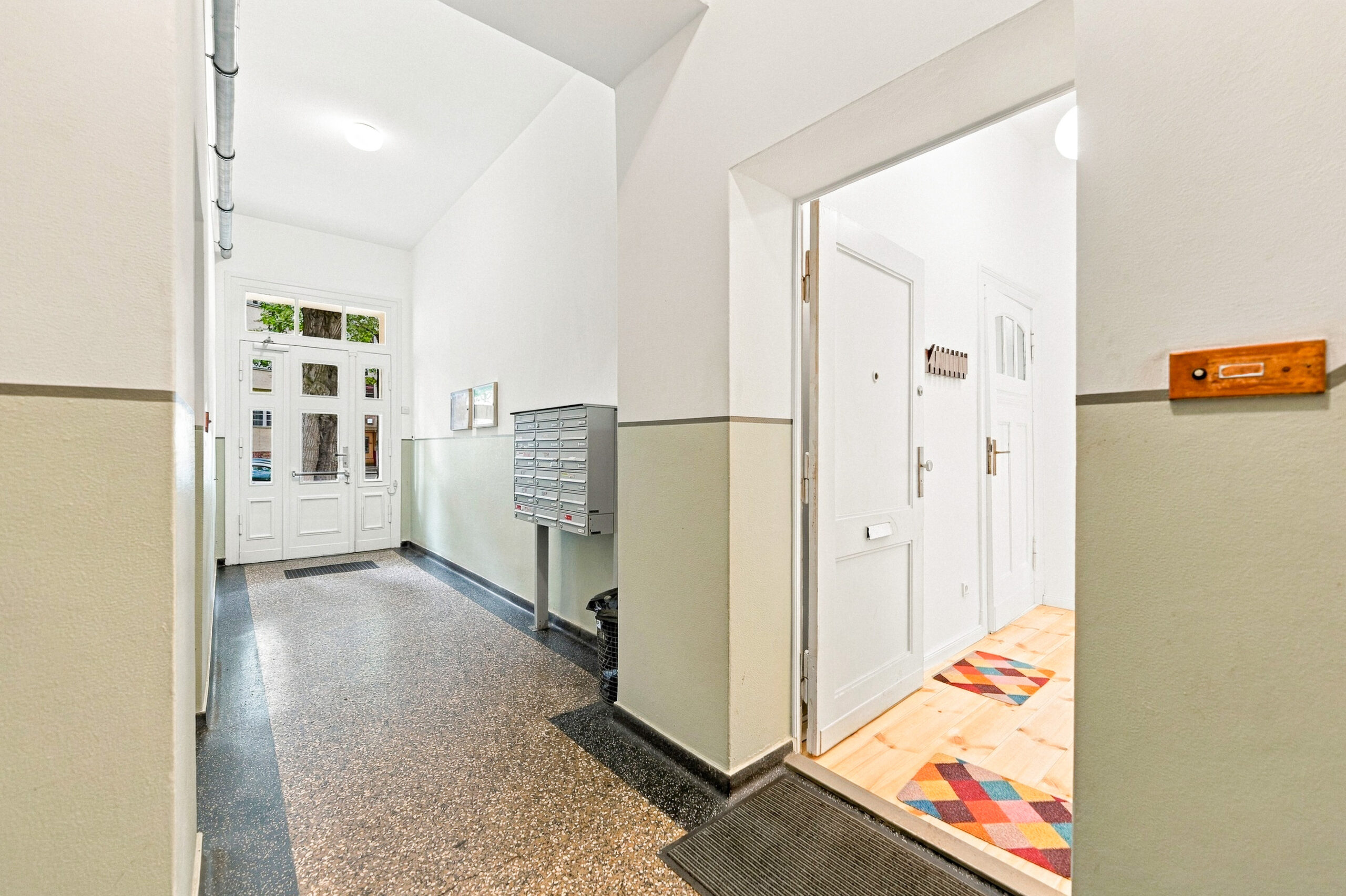 Apartment entrance hallway with open door